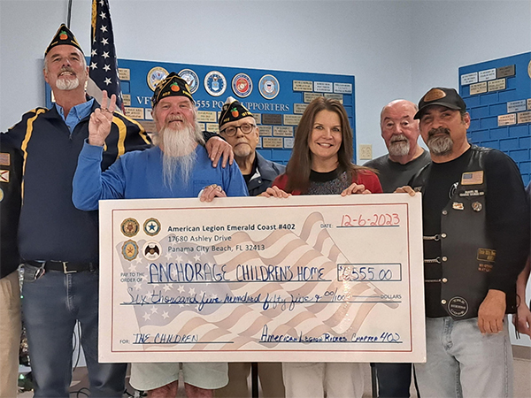 American Legion Emerald Coast presenting a donation check